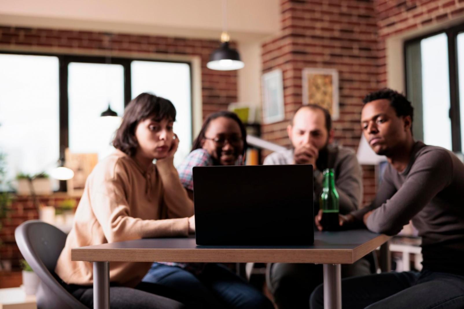 Students analyzing investment scenarios during group session
